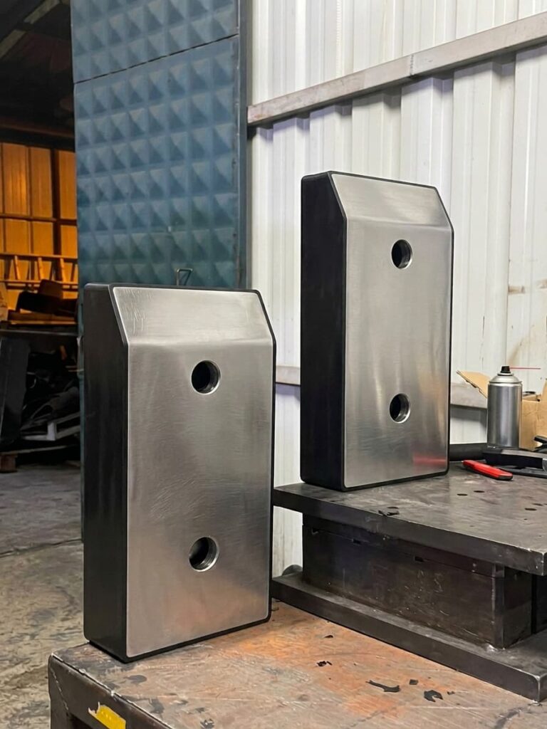 Pair set of steel-plated heavy-duty rubber loading bay bumpers